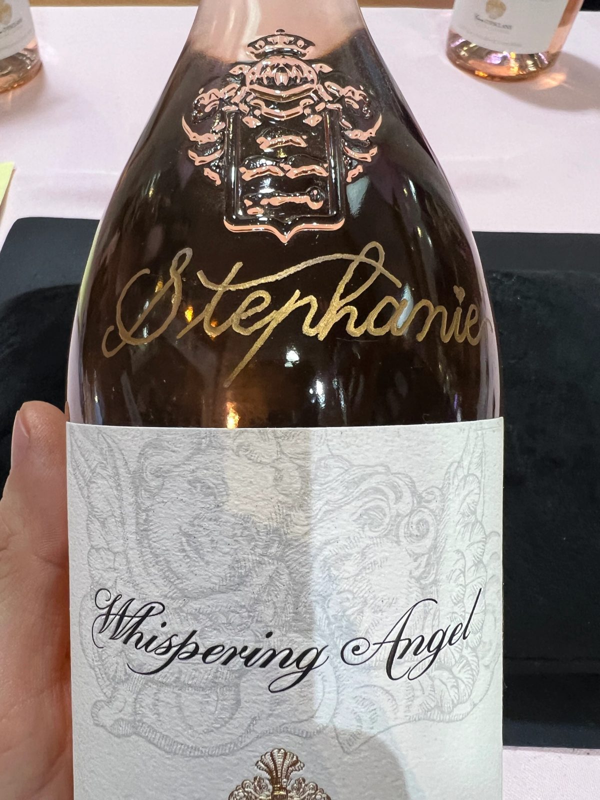 Wine bottle personalized with engraved lettering and decorative detail