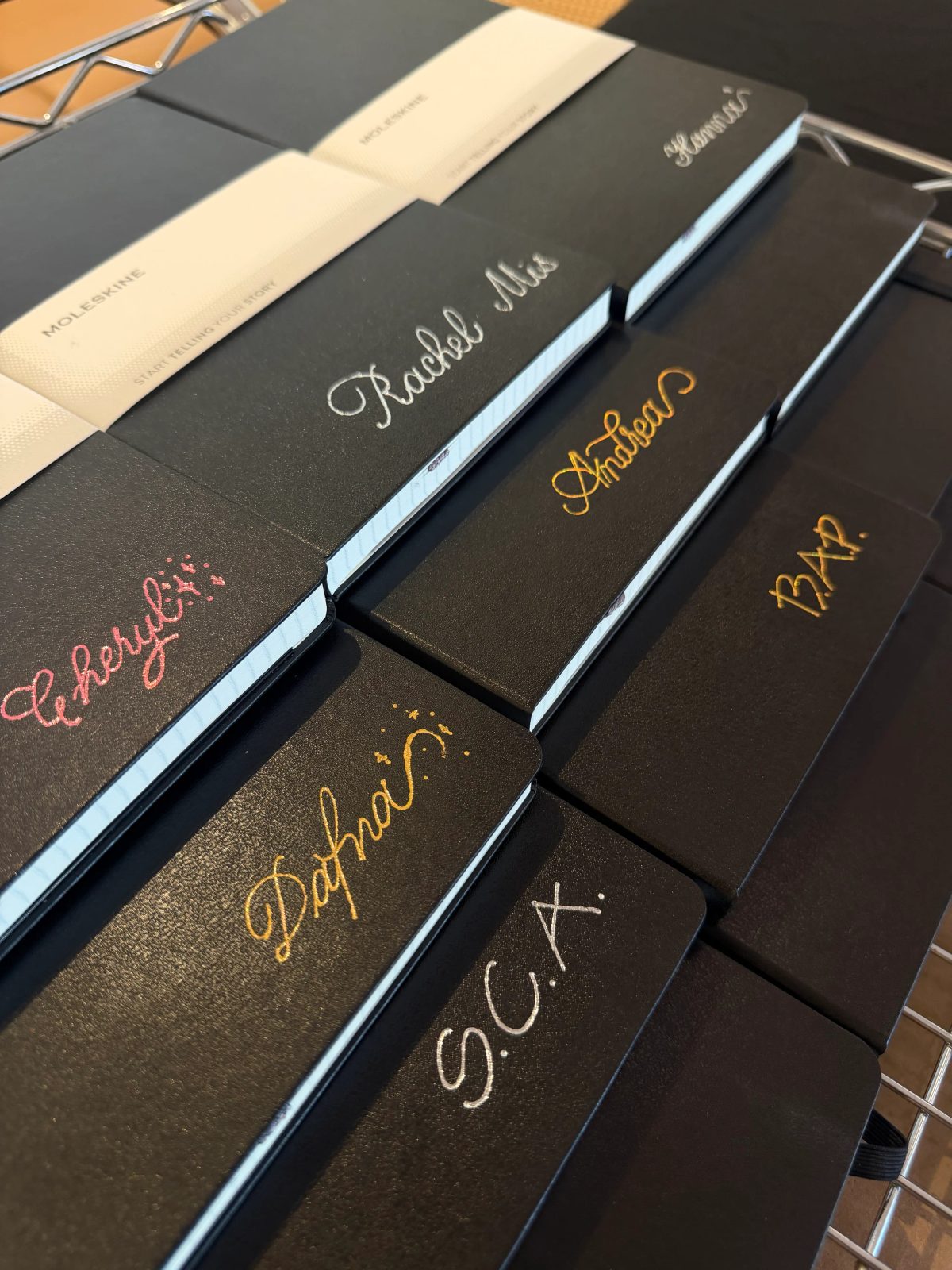 Custom hand lettering on a notebook cover