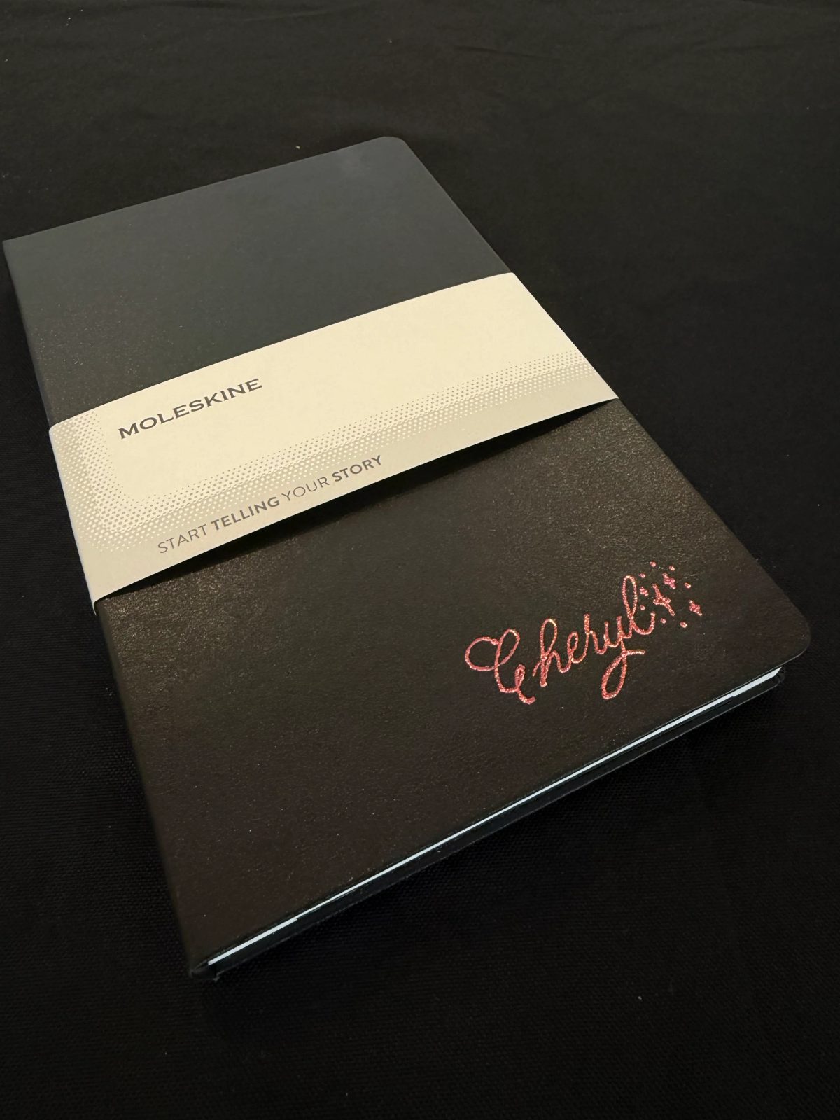 Custom hand lettering on a notebook cover