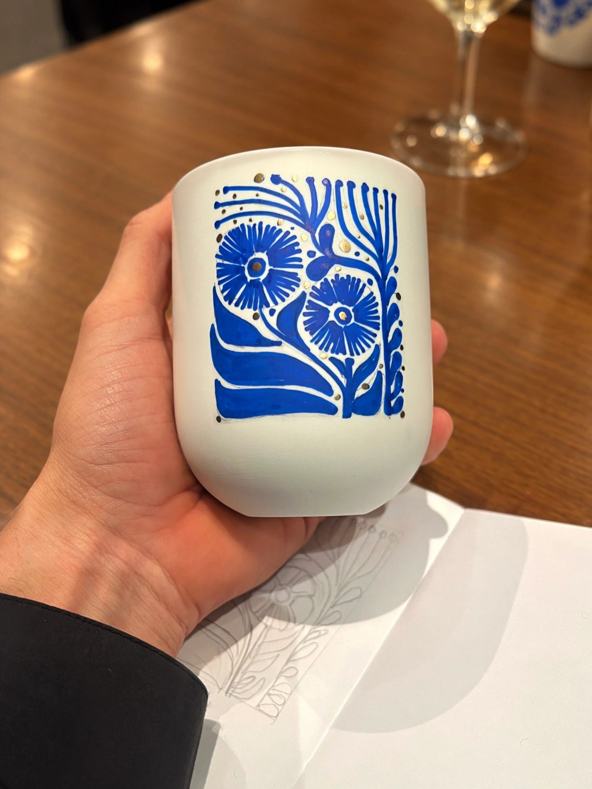 Personalized ceramic cup with hand-drawn lettering or illustration