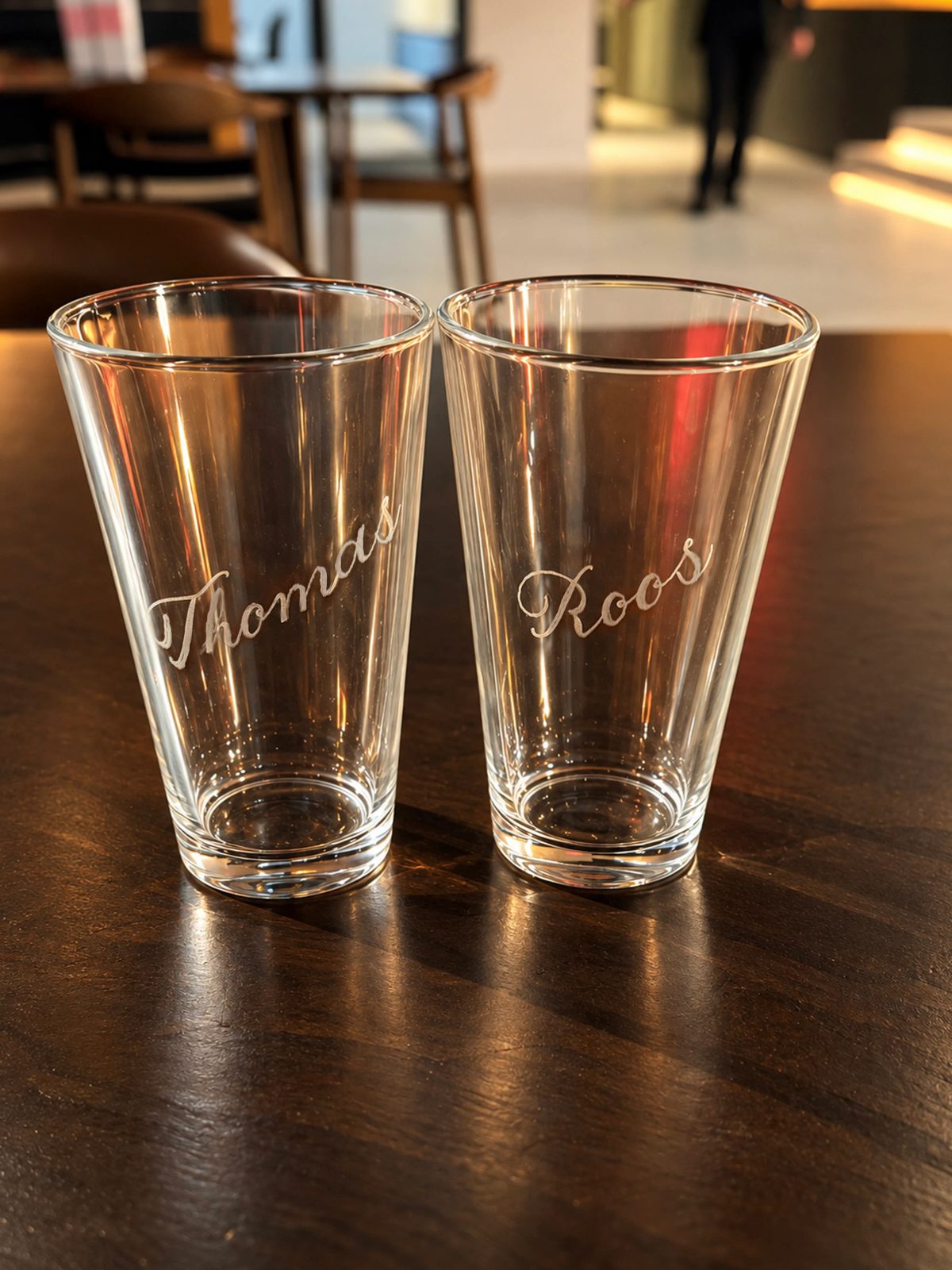 Hand-engraved lettering on a drinking glass