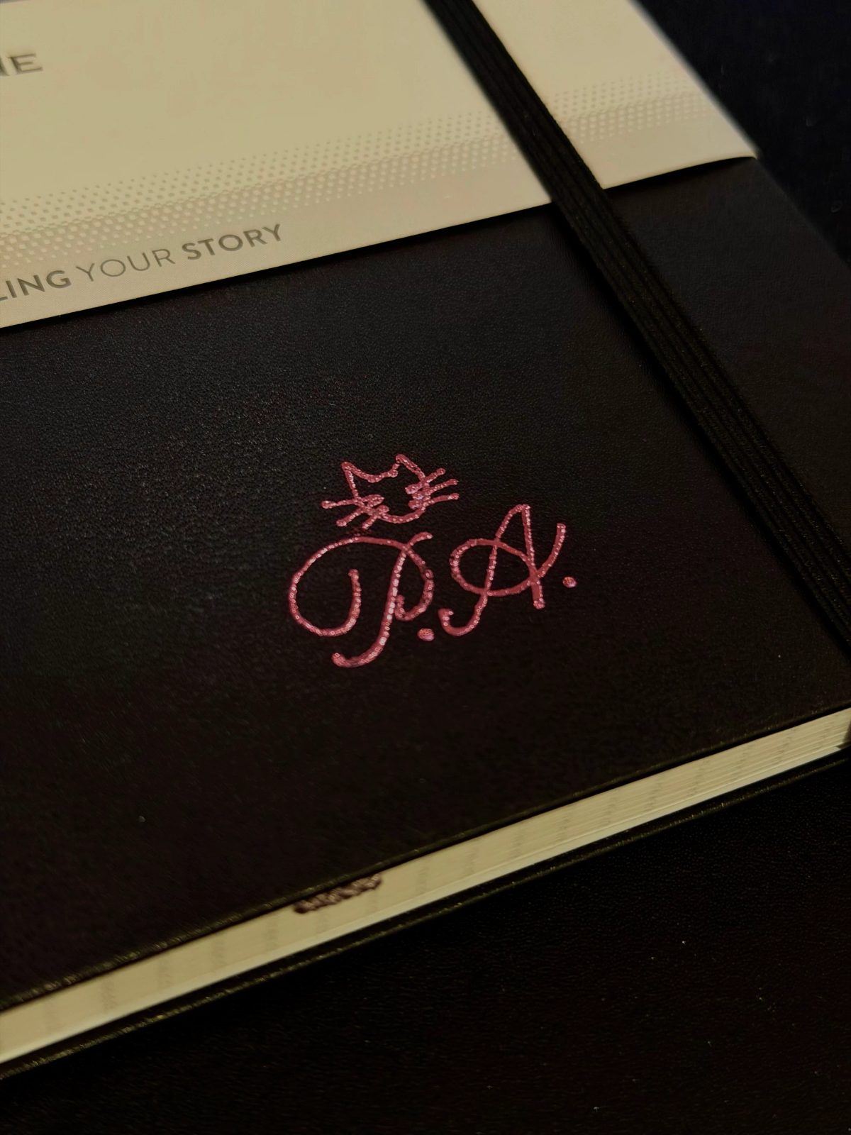 Custom hand lettering on a notebook cover