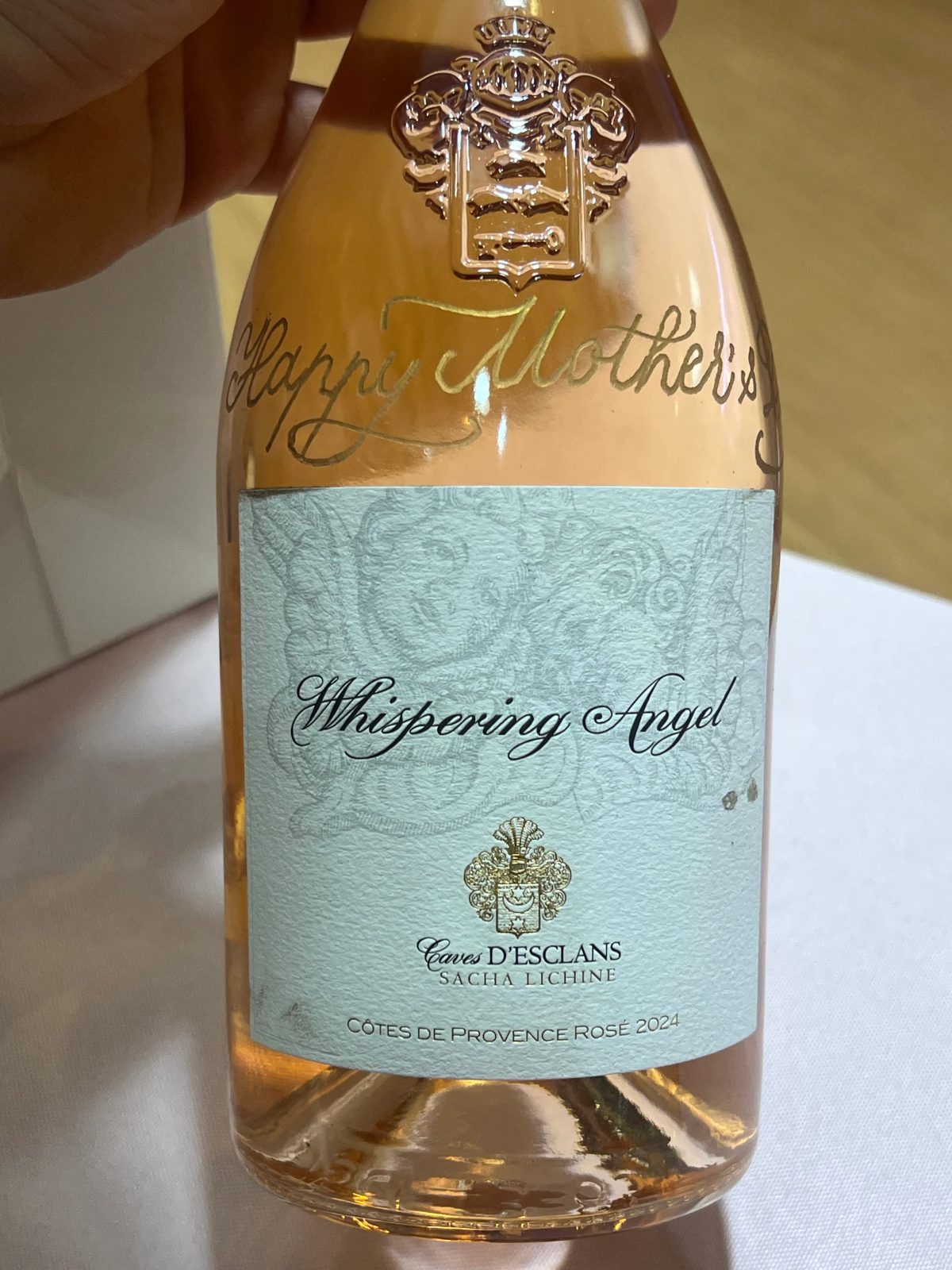 Wine bottle personalized with engraved lettering and decorative detail