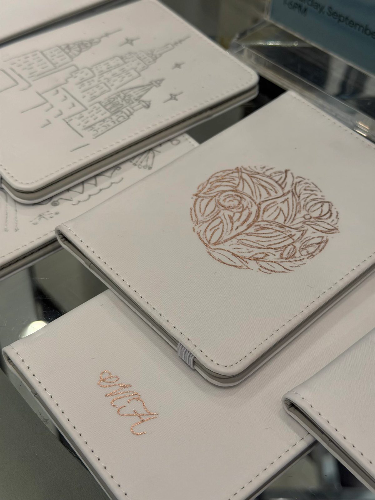 Fine architectural and botanical illustration on a small white notebook