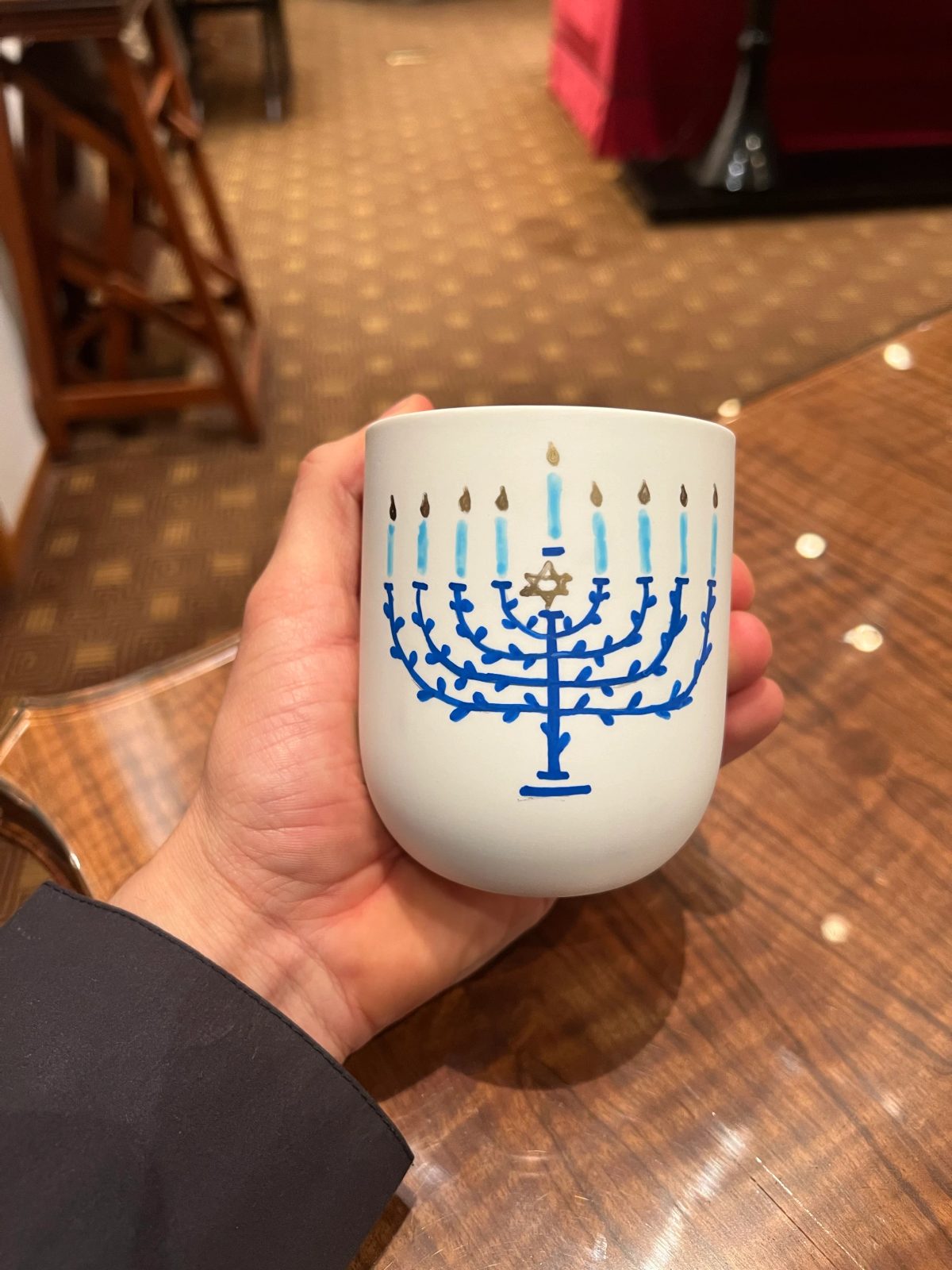 Personalized ceramic cup with hand-drawn lettering or illustration