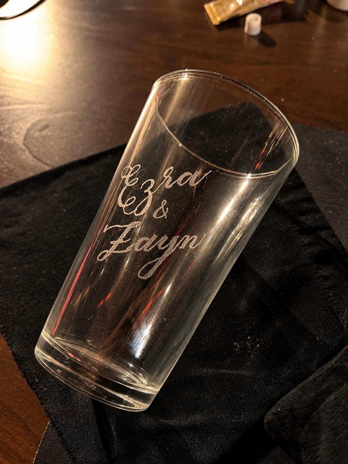 Hand-engraved lettering on a drinking glass