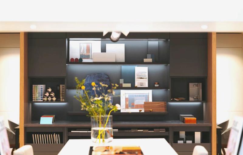 Kitchen showroom, shelves of samples and a bouquet on the table