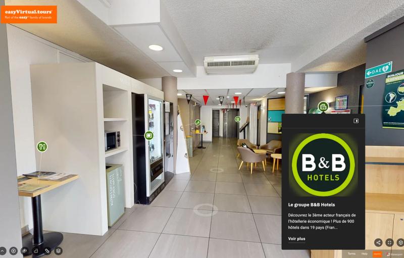 Lobby of a B&B hotel in the tour, with the group's information bubble