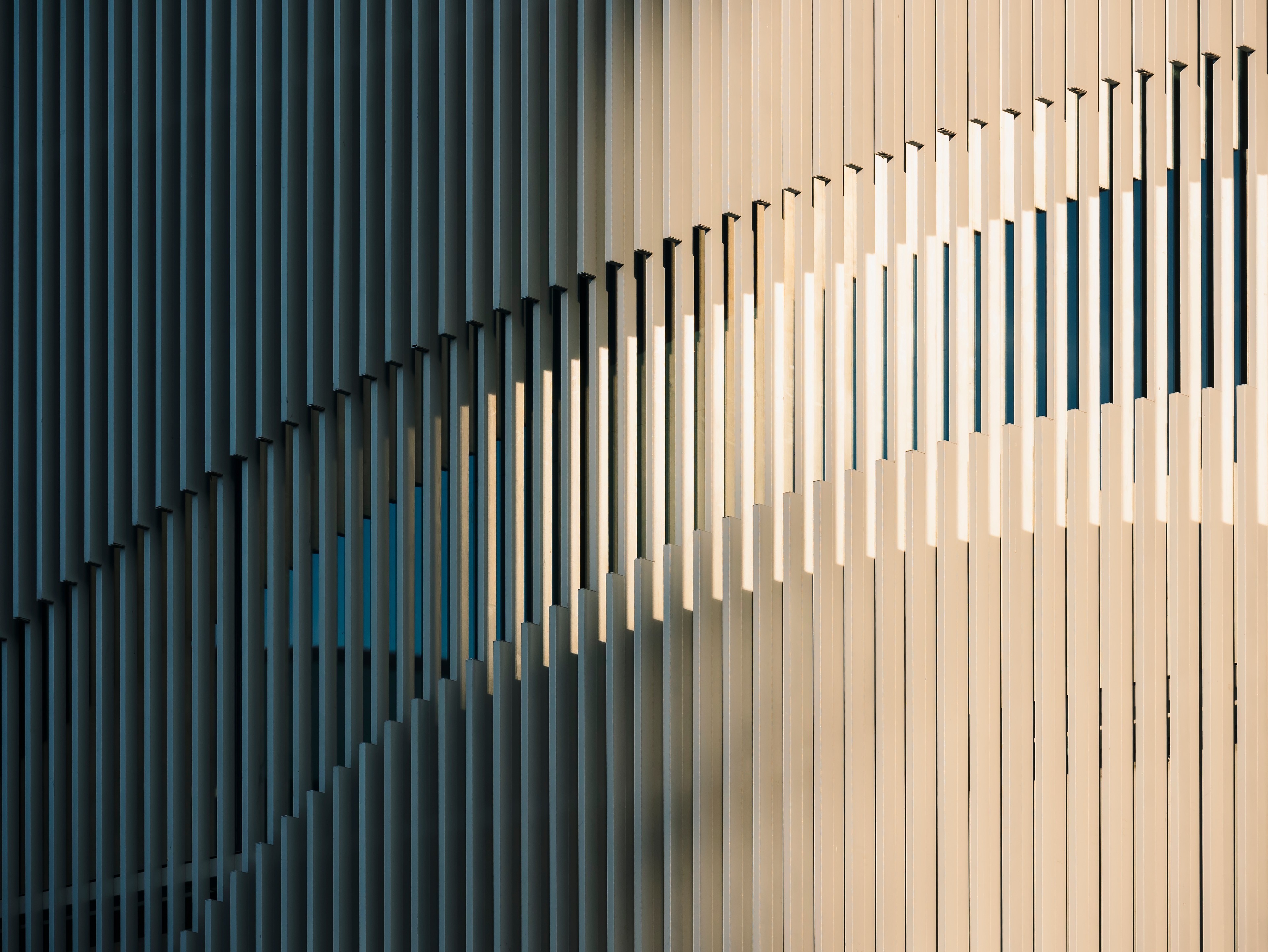 Abstract architectural facade with rhythmic repeating vertical fins