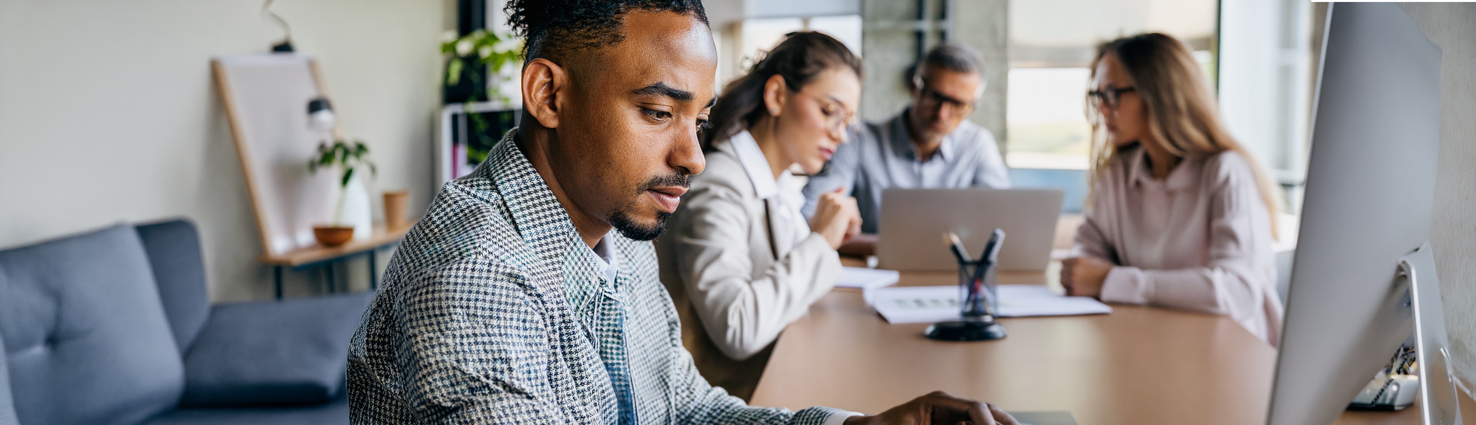 Professionals collaborating in a modern workplace