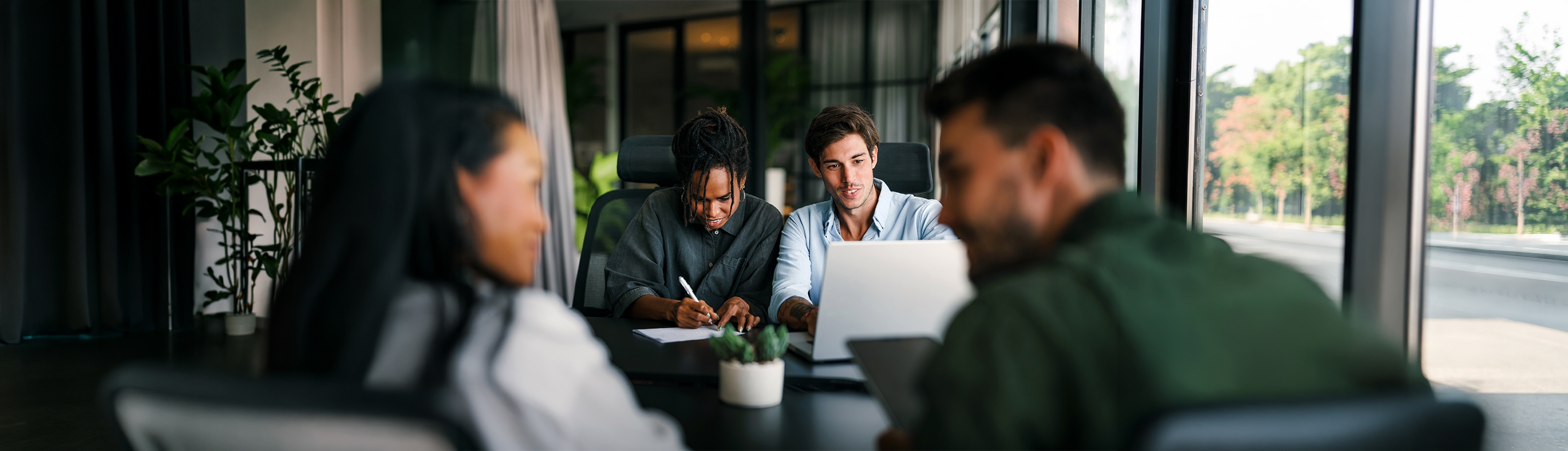 Professionals collaborating in a modern workplace