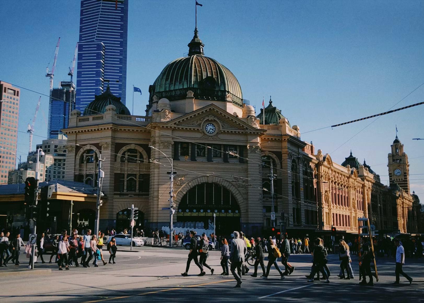 People moving together across Flinders Street, Melbourne