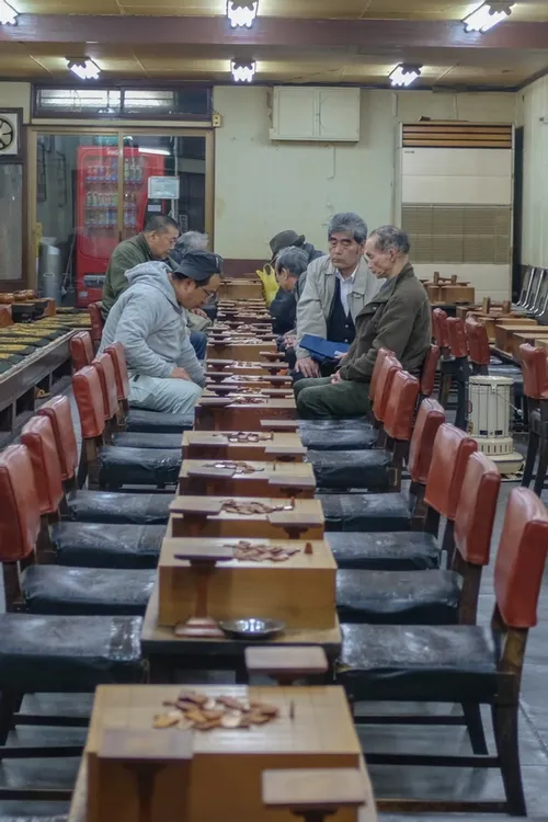 Japanese blokes playing a traditional board game