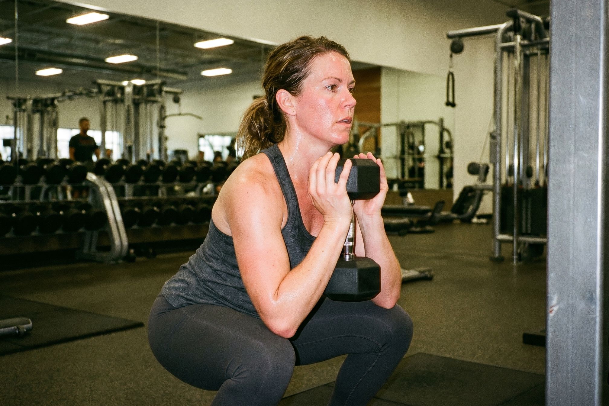 Goblet squat with a dumbbell. The first exercise in a beginner longevity strength program.