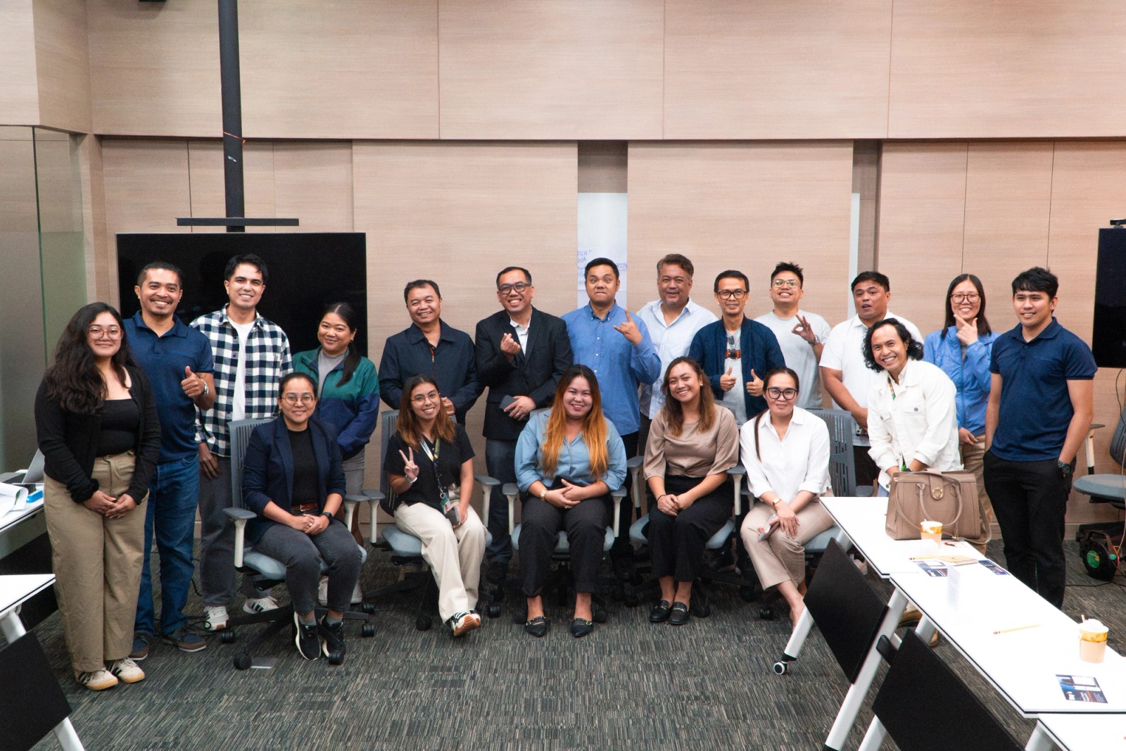 The team assembled in a conference room after a working session