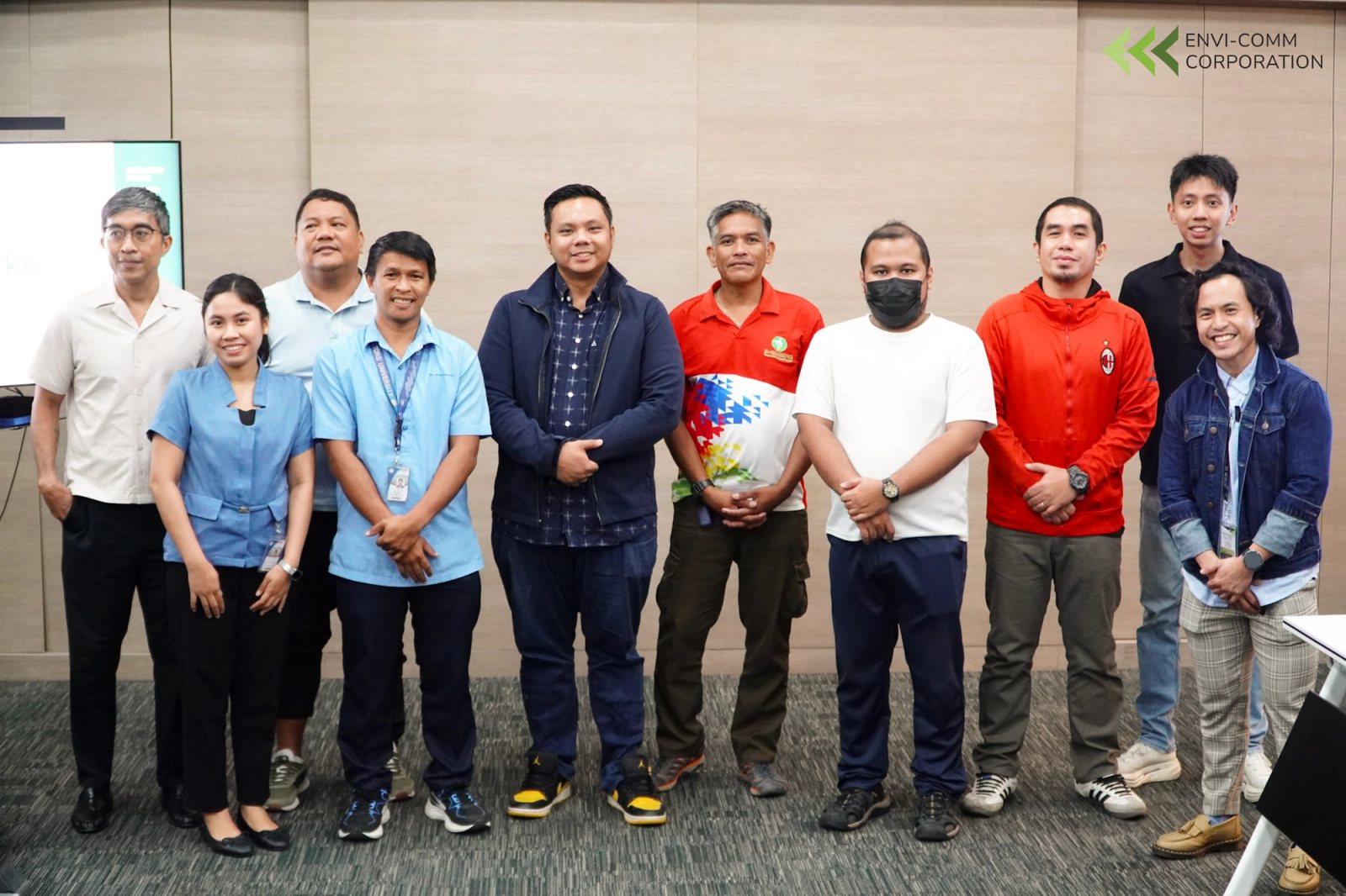 A group at a turnover ceremony holding a presentation bouquet