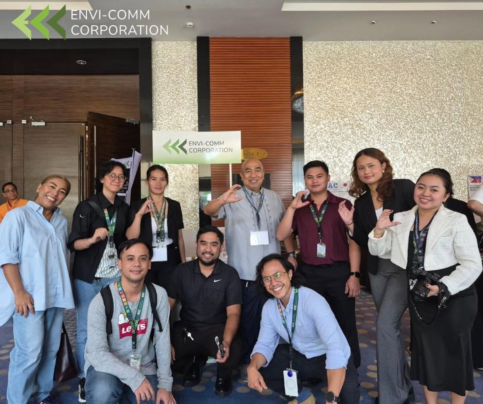 The team gathered at their booth during a conference