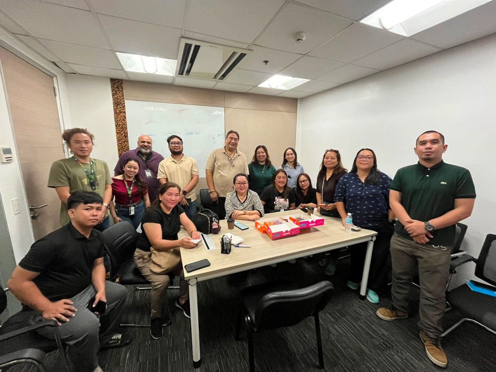 The team gathered around a table at the end of a planning meeting