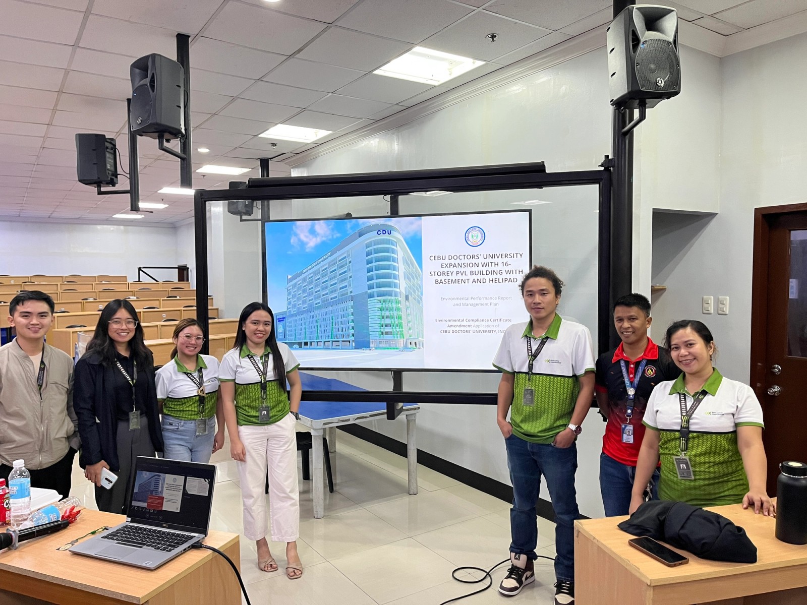 A project team presenting a building expansion compliance report