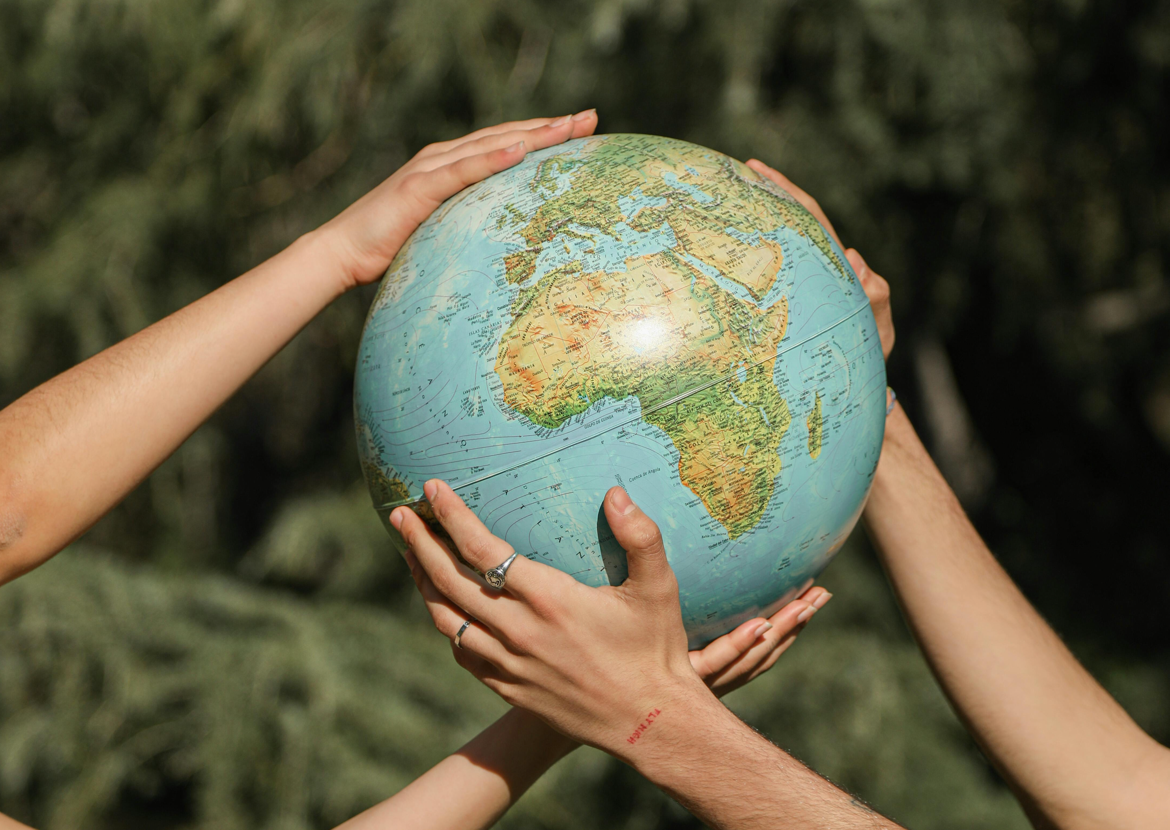 earth in our hands, two people holding earth in nature