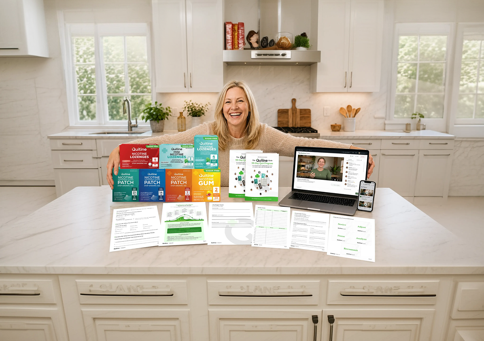 Janelle with the full Quitine range, the 90-Day Quit Program workbook and the Quitine Circle on a laptop
