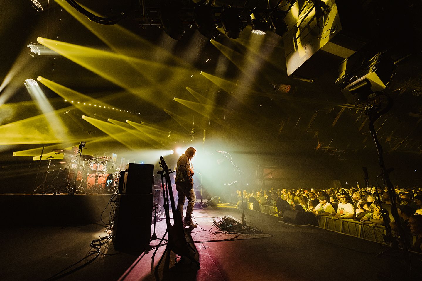 Goose band on stage with yellow light behind them