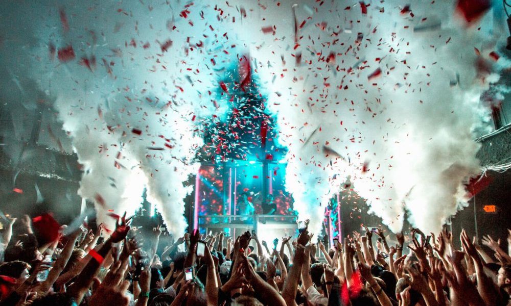 Liquid venue in Madison, Wisconsin with Co2 going off and confetti in the air crowds hands in air