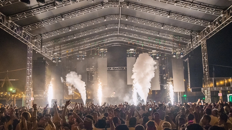 CO2 blasts in front of a packed crowd at the Papas & Beer main stage during spring break.