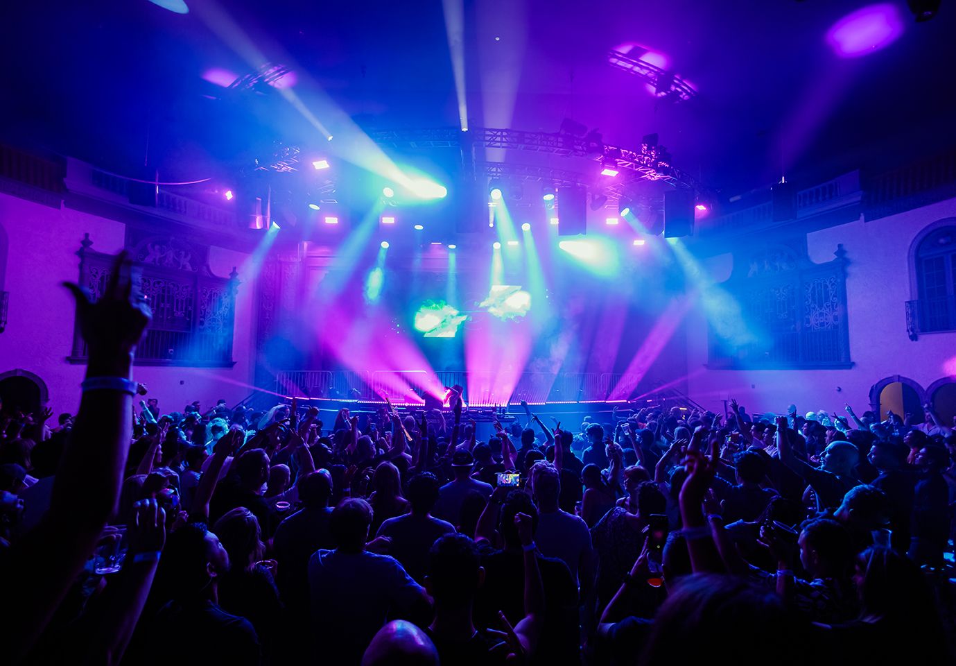 View from the floor crowd of the Ramova Theatre stage with purple and blue lights