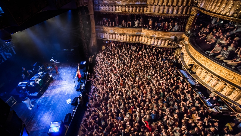 House of Blues arial shot from the stage right view. A large crowd fills the first floor, 2nd floor as the band plays