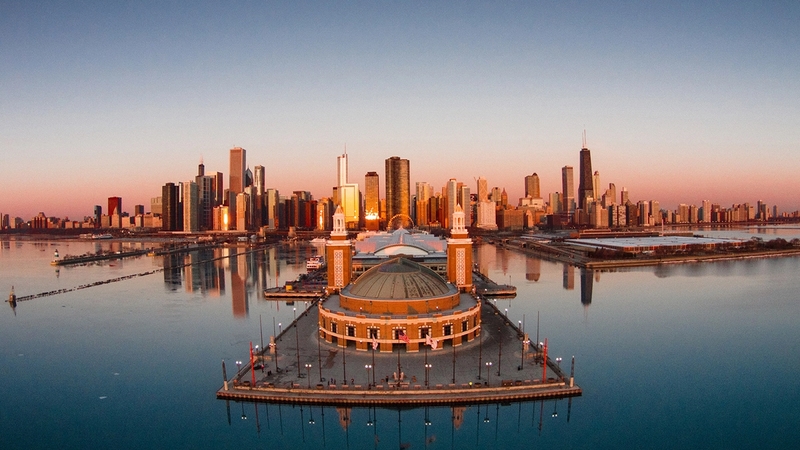 View of the end of Navy Pier in Chicago at dawn with the city skyline in the background