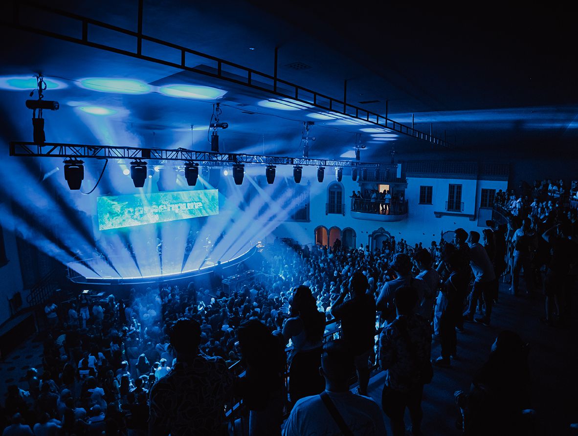 View of the stage at Ramova Theatre with blue lights shining from the front of the stage