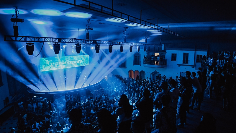 View of the stage at Ramova Theatre with blue lights shining from the front of the stage
