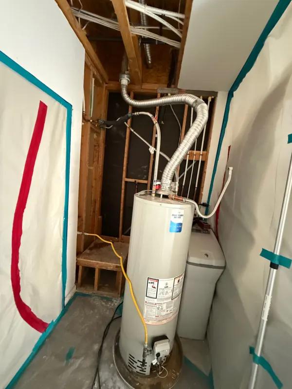 Moisture meter reading on wood framing during water damage inspection in Henderson, NV
