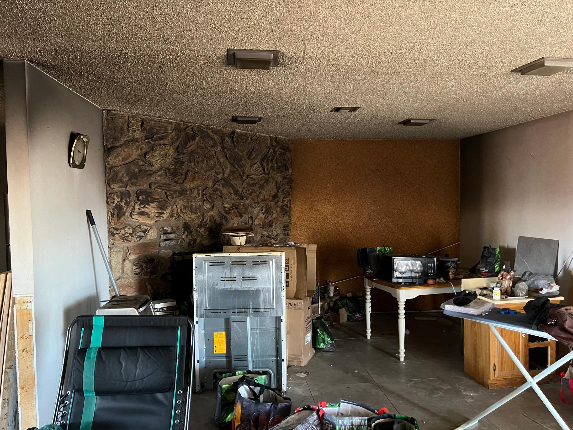 Smoke-stained Henderson room after a fire with soot visible on walls and ceiling during fire and smoke damage restoration