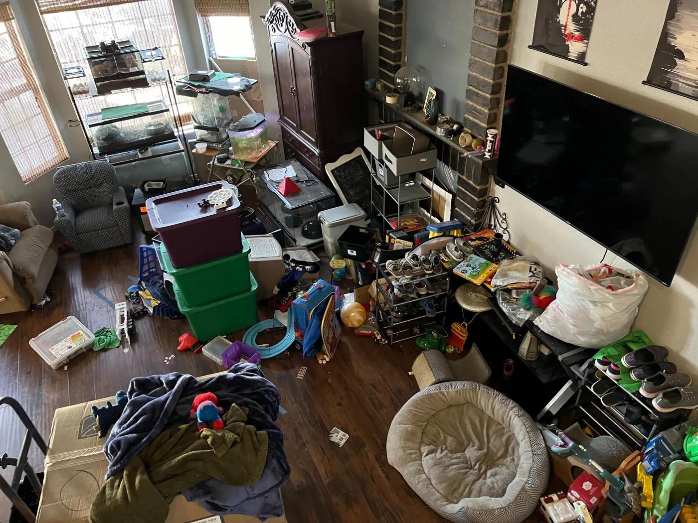 Cluttered living room before hoarding cleanup in Henderson, NV