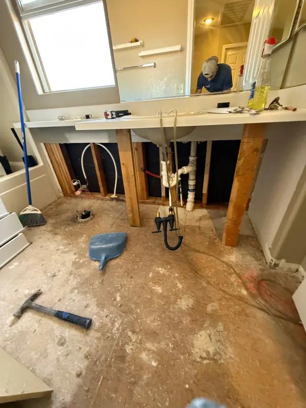 Bathroom restoration drying process after water damage in a Henderson home