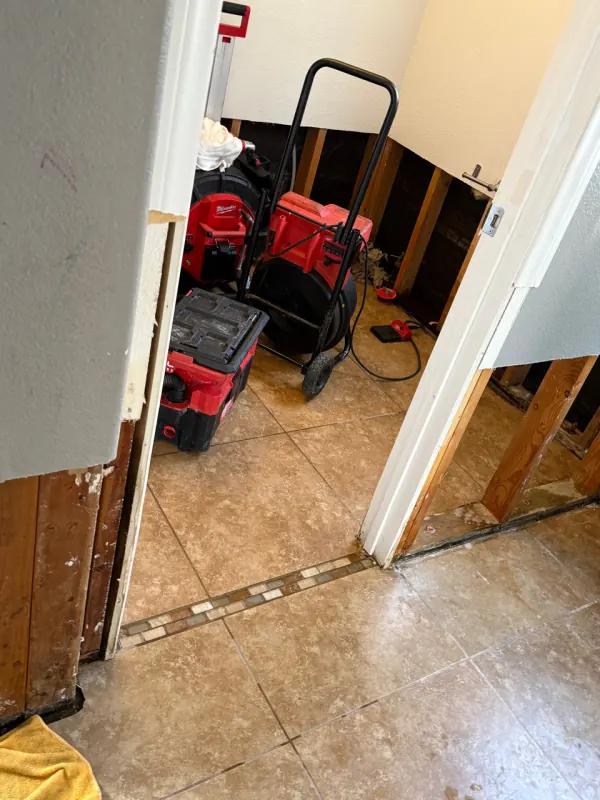 Air mover drying equipment setup on water-damaged flooring during a water damage restoration service job in Henderson, NV