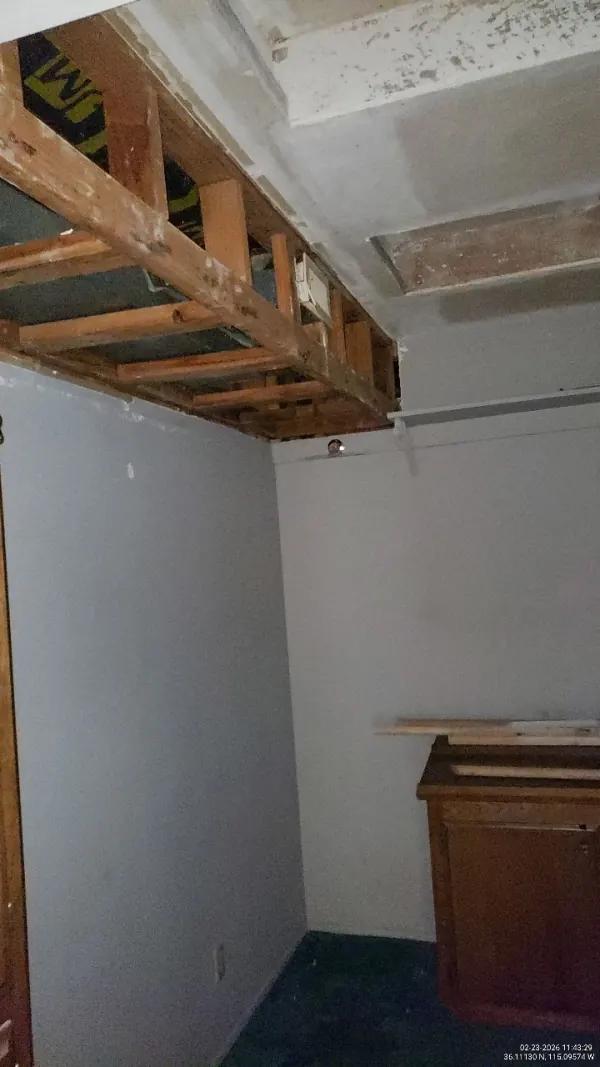 Bathroom ceiling drywall damage from upstairs water leak before restoration in Henderson, NV
