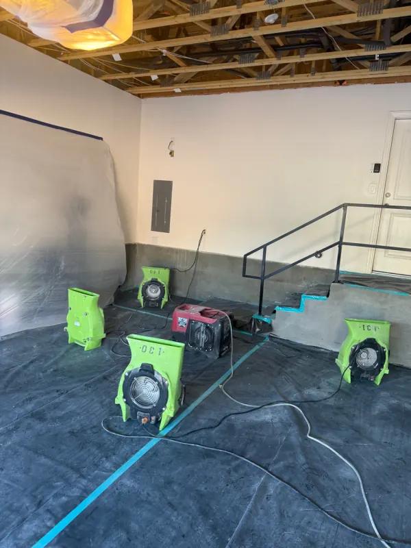 Water extraction from carpeted floor after a flood in a Henderson home