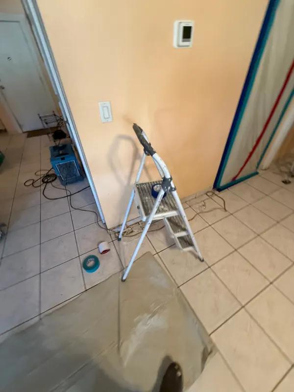 Commercial dehumidifier removing moisture during structural drying on a Henderson water damage restoration job