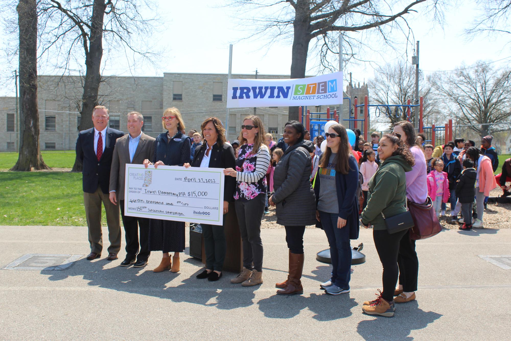 A press conference and award of a big check at Irwin Elementary School for a new playground.