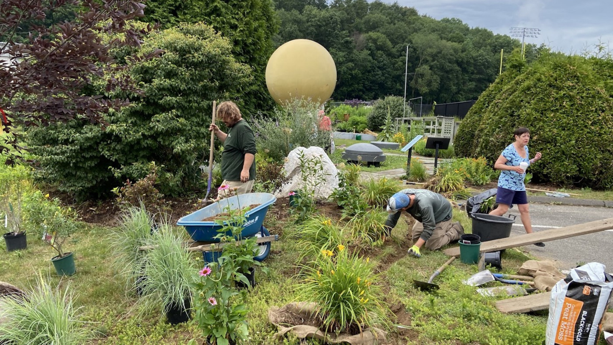 Volunteers working on the pollinator garden. 