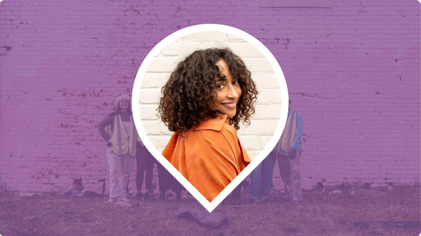 Headshot of Alice James looking over her shoulder within a pin icon, over a purple background.