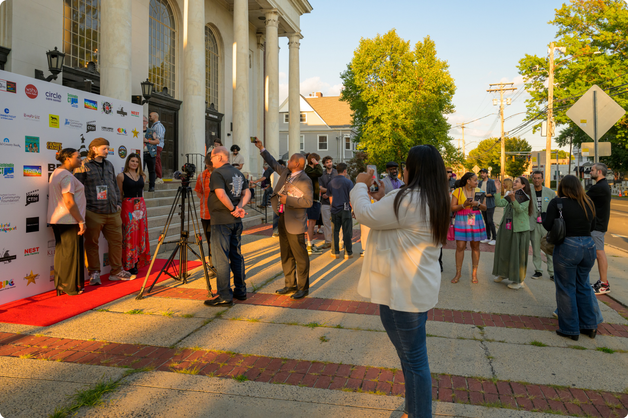 People gather to take photos at the Bridgeport Film Fest’s opening night red carpet