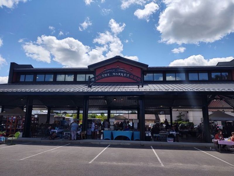 The Market at Cadillac Commons is a large open air pavilion with farmers market vendors inside.