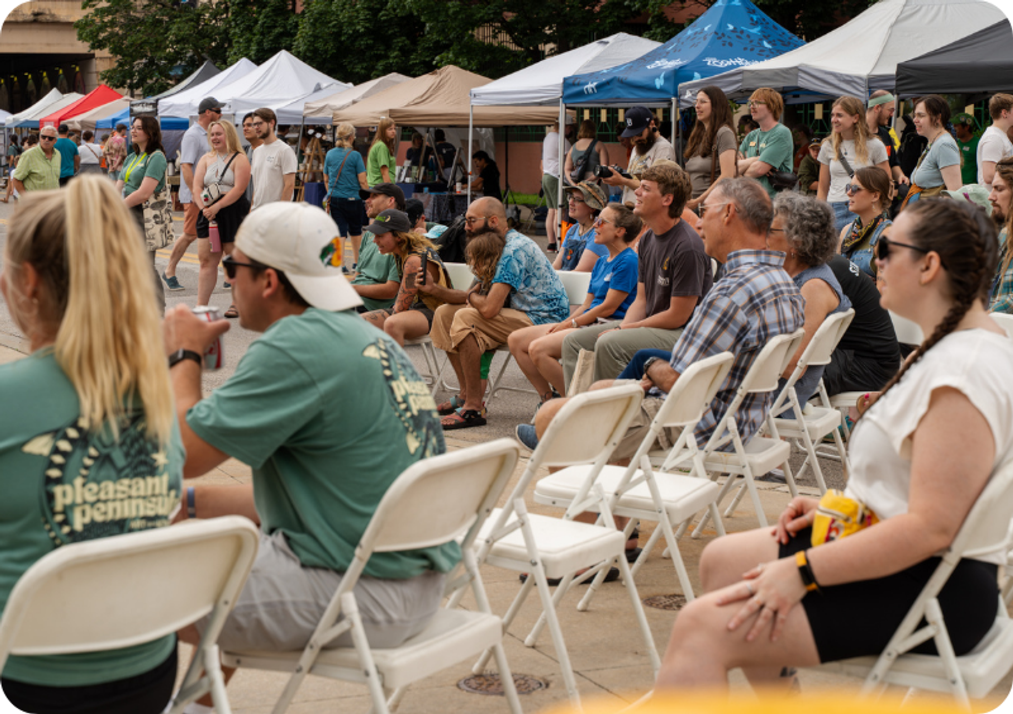 Community members fill the seats at the Pleasant Peninsula Mural Festival