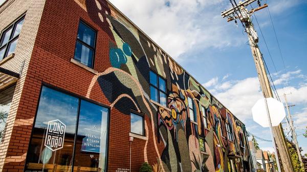 The Long Road Distillers Mural by artists Brooke Rosier and Kyle Degroff for the After Dark project in Grand Rapids, Michigan.