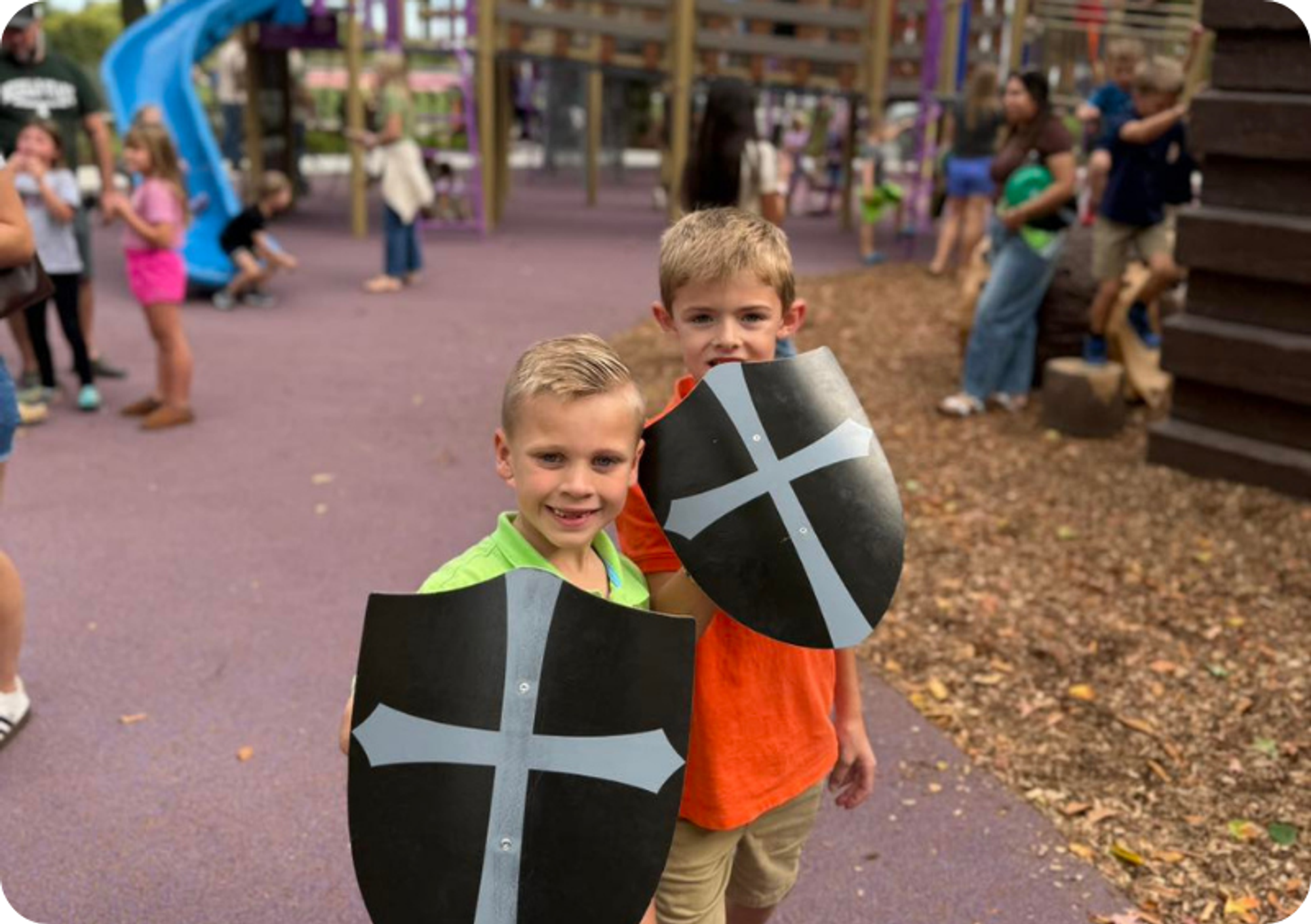 Two boys pose with their medieval shields