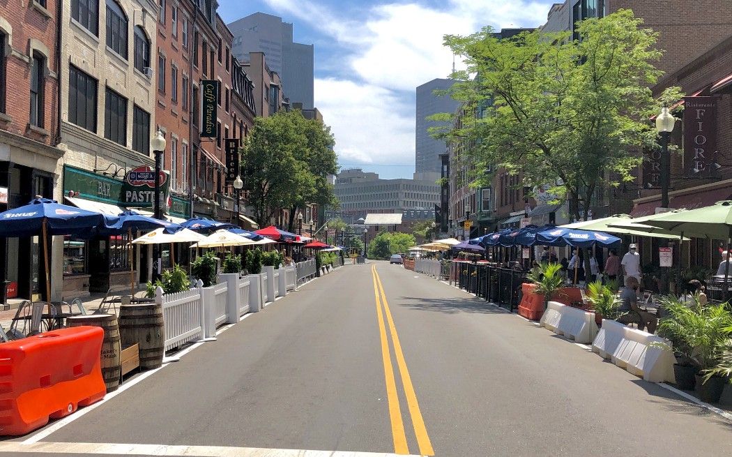 Boston’s Hanover Street in the North End, July 2020, lined with barricades to create safe outdoor dining.